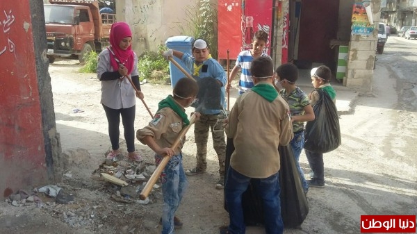 صورة الكشافة تساهم في عملية النظافة